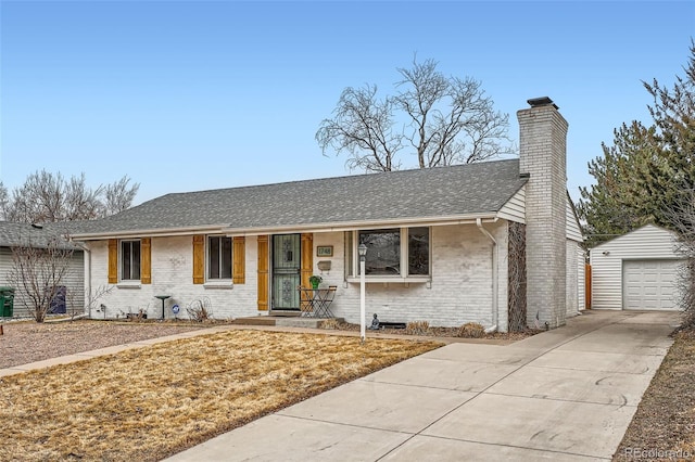 ranch-style house with a shingled roof, a chimney, an outbuilding, covered porch, and brick siding