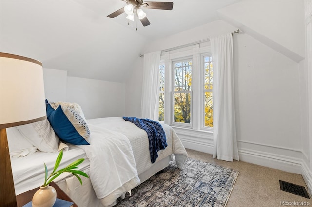 bedroom featuring lofted ceiling, carpet, and ceiling fan