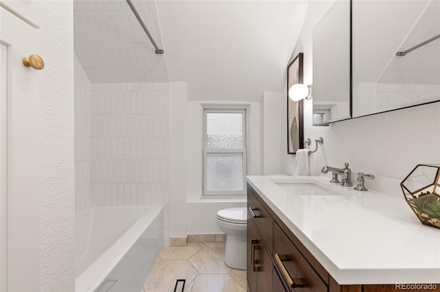 full bathroom with vaulted ceiling, toilet, vanity, tiled shower / bath combo, and tile patterned floors