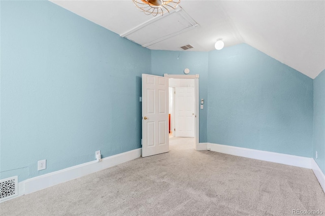 additional living space with lofted ceiling and light colored carpet