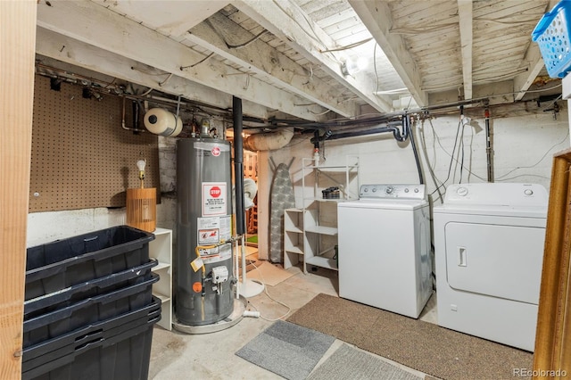 basement with separate washer and dryer and water heater