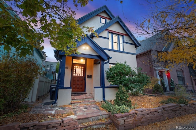 408 E 1st Ave, Denver, CO 80203 - view of front facade featuring stucco siding and fence