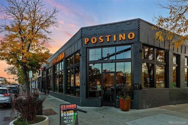 view of outdoor building at dusk