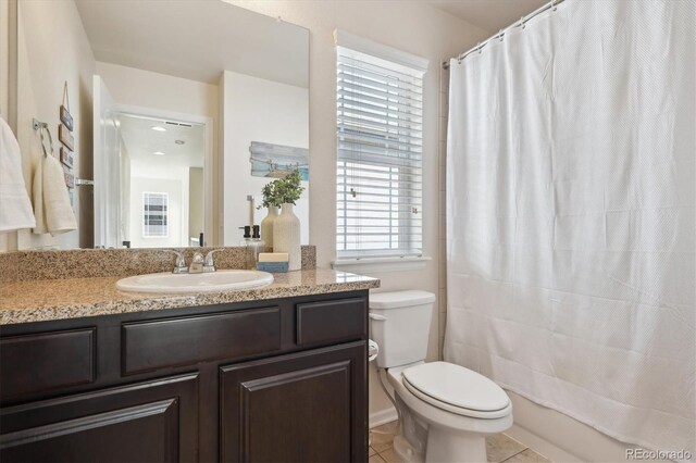 full bathroom featuring toilet, tile patterned flooring, shower / bathtub combination with curtain, and vanity