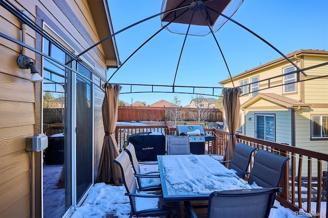 view of snow covered deck