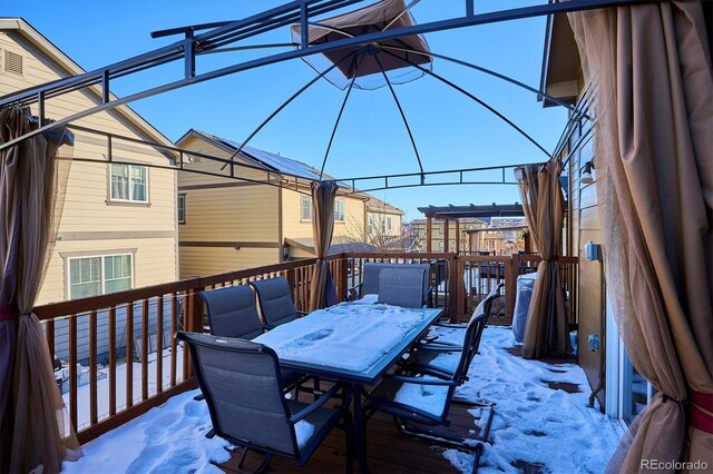 view of snow covered deck