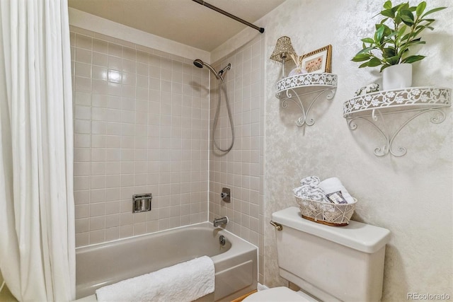 bathroom featuring toilet and shower / tub combo