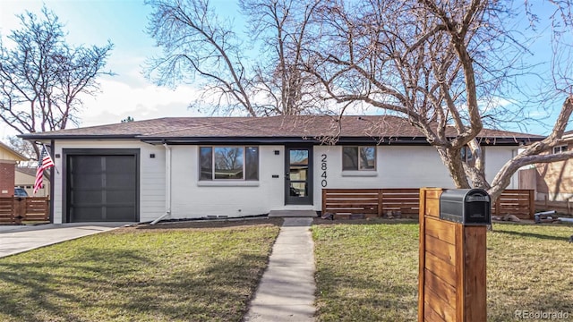 ranch-style home featuring brick siding, fence, a front yard, a garage, and driveway