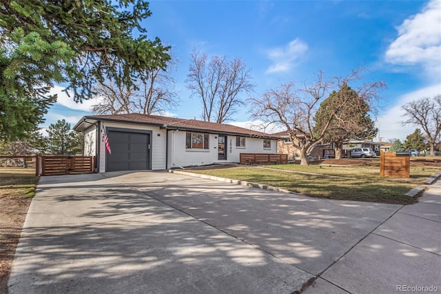 ranch-style house with a garage, concrete driveway, a front lawn, and fence