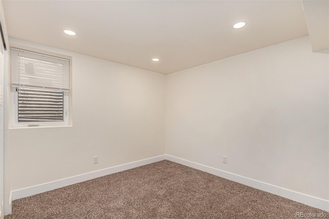 unfurnished room with carpet flooring, recessed lighting, and baseboards