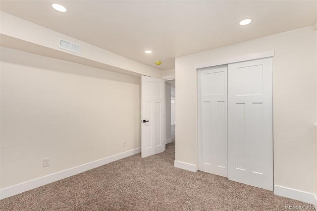 unfurnished bedroom with recessed lighting, baseboards, visible vents, and light carpet