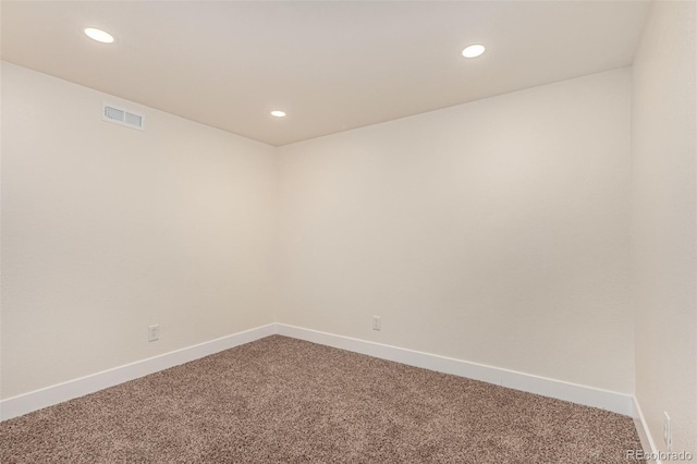 spare room with recessed lighting, visible vents, carpet floors, and baseboards