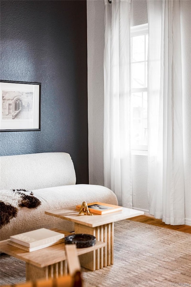 sitting room with hardwood / wood-style flooring