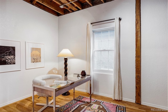 office space with hardwood / wood-style flooring and beamed ceiling