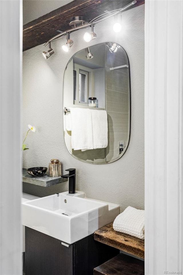 2731 California St, Denver, CO 80205 - bathroom with a textured wall and vanity