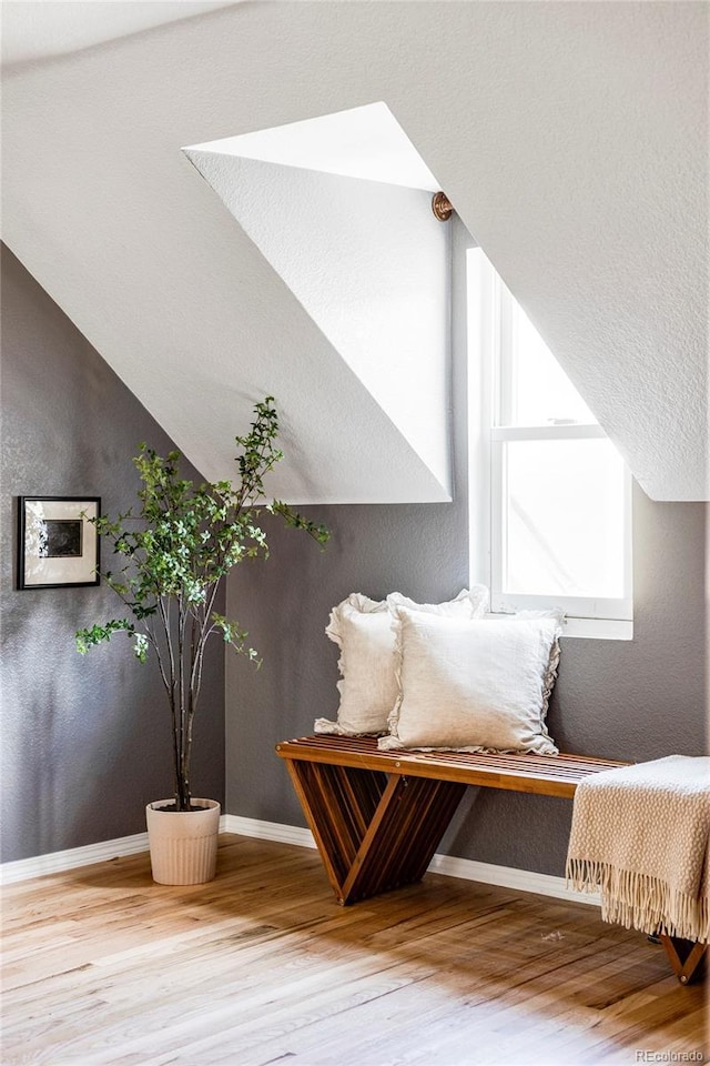 2731 California St, Denver, CO 80205 - living area featuring wood finished floors and a textured wall