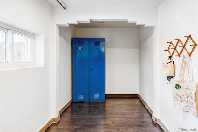 2731 California St, Denver, CO 80205 - unfurnished room with dark wood-style flooring and baseboards