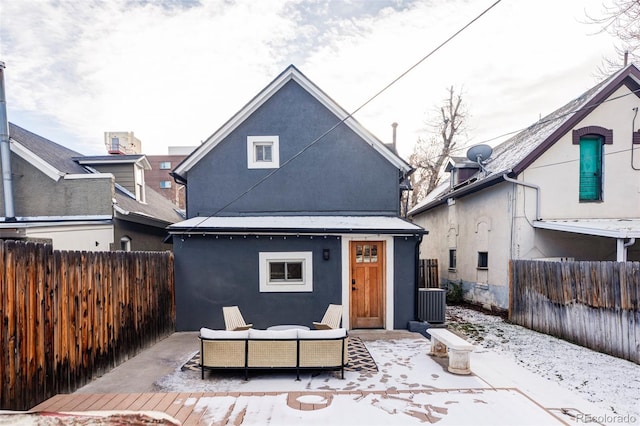 rear view of house featuring an outdoor hangout area and central AC unit