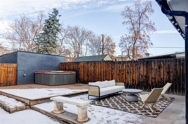 view of patio featuring an outdoor living space and a hot tub