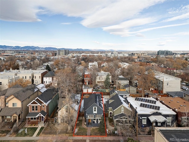 2731 California St, Denver, CO 80205 - aerial view of residential area with property parcel outlined and a mountain backdrop