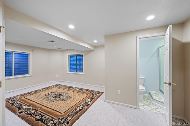 finished below grade area featuring baseboards, recessed lighting, and carpet flooring