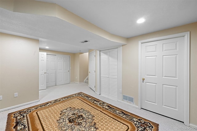 finished basement featuring baseboards, carpet floors, stairway, and recessed lighting