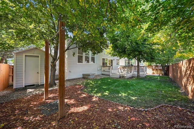 back of property featuring a shed, a wooden deck, and an outdoor structure