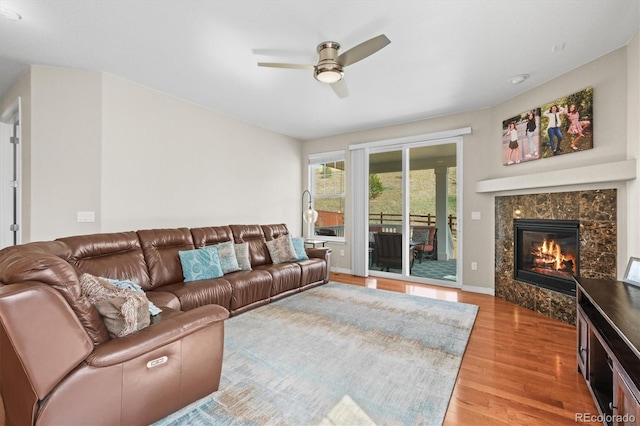 6174 Flattop St, Golden, CO 80403 - living area with wood finished floors, ceiling fan, and a premium fireplace
