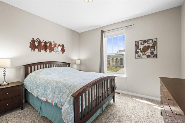 6174 Flattop St, Golden, CO 80403 - bedroom featuring light carpet and baseboards