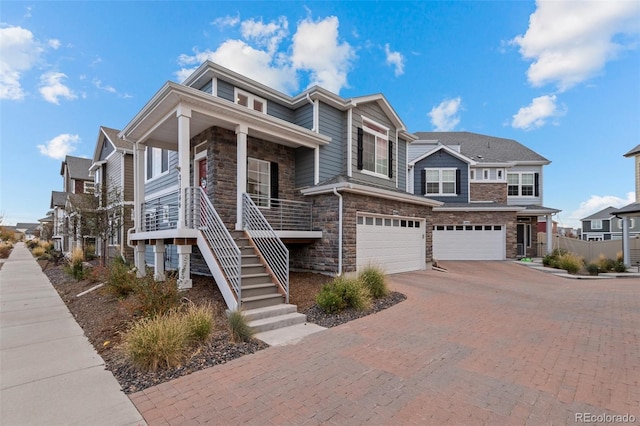 view of front facade with a porch and a garage