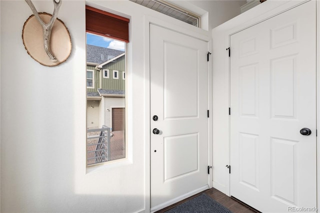 doorway featuring dark hardwood / wood-style floors