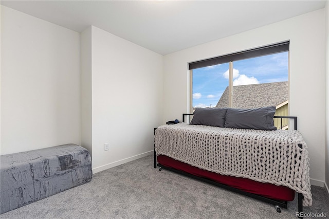 bedroom featuring light carpet