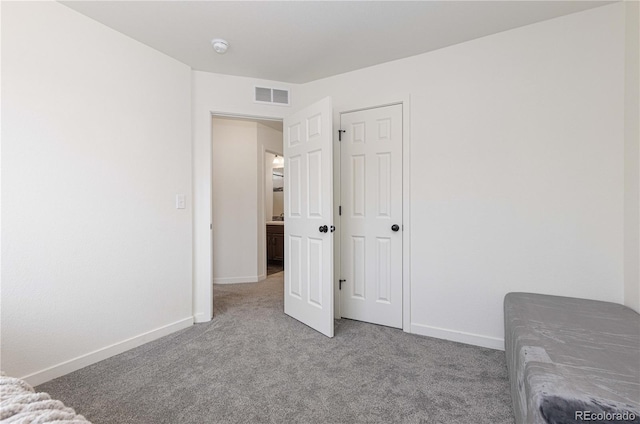 unfurnished bedroom featuring light colored carpet