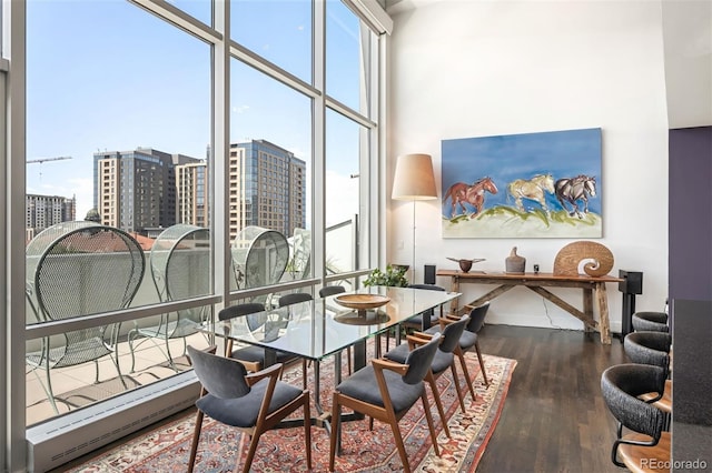 55 W 12th Ave Unit 608, Denver, CO 80204 - dining space featuring plenty of natural light, wood finished floors, floor to ceiling windows, and a view of city