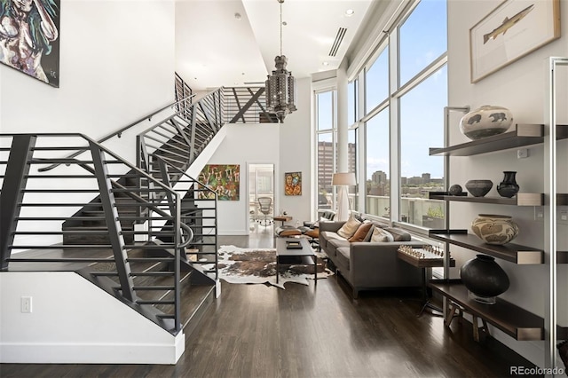 55 W 12th Ave Unit 608, Denver, CO 80204 - living room featuring a high ceiling, stairway, and wood finished floors