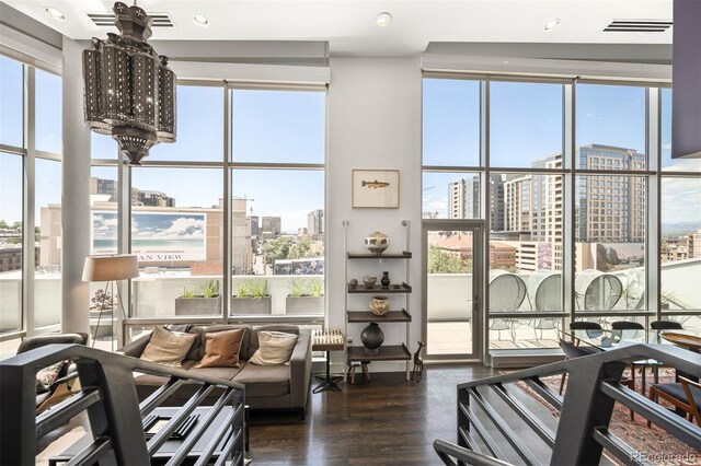 55 W 12th Ave Unit 608, Denver, CO 80204 - workout area featuring healthy amount of natural light, a view of city, dark wood-type flooring, recessed lighting, and floor to ceiling windows