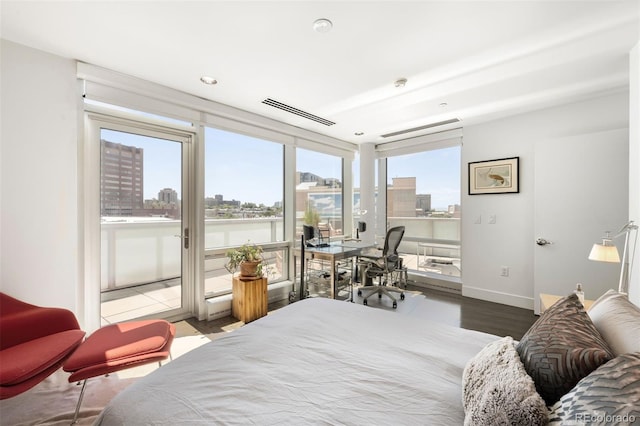 55 W 12th Ave Unit 608, Denver, CO 80204 - bedroom featuring access to outside, a city view, wood finished floors, and a water view