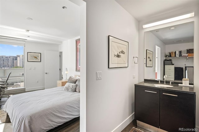 55 W 12th Ave Unit 608, Denver, CO 80204 - bedroom featuring a sink and baseboards