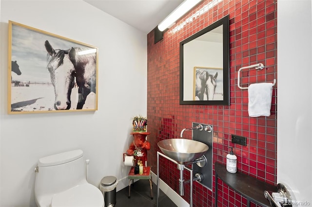 55 W 12th Ave Unit 608, Denver, CO 80204 - bathroom featuring an accent wall and tile patterned flooring