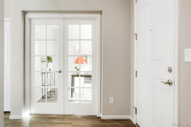 6041 N Orleans St, Aurora, CO 80019 - doorway to outside featuring wood finished floors and baseboards