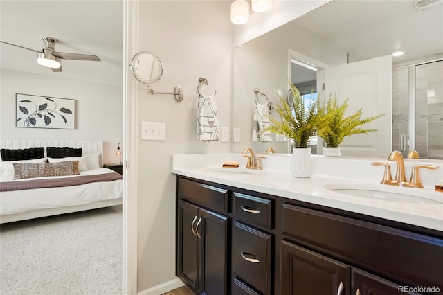6041 N Orleans St, Aurora, CO 80019 - full bath with double vanity, connected bathroom, a stall shower, and a ceiling fan