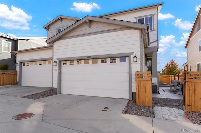 6041 N Orleans St, Aurora, CO 80019 - view of front of house featuring an attached garage and driveway