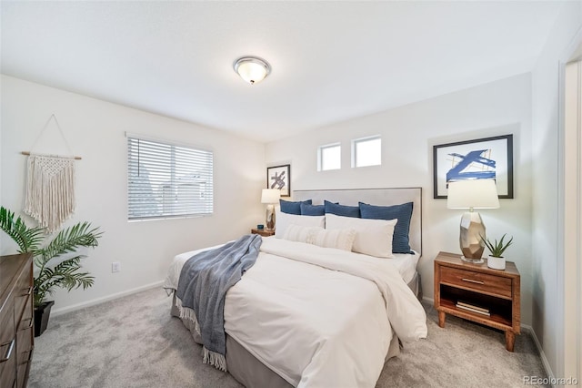 bedroom with carpet flooring and baseboards