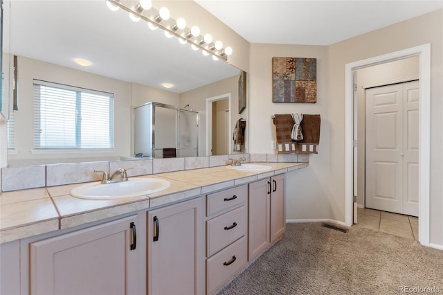 1825 Cooper Ct, Castle Rock, CO 80109 - full bath with double vanity, an enclosed shower, and baseboards