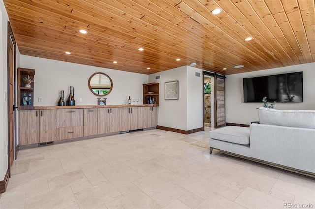 living room with sink, wood ceiling, and a barn door