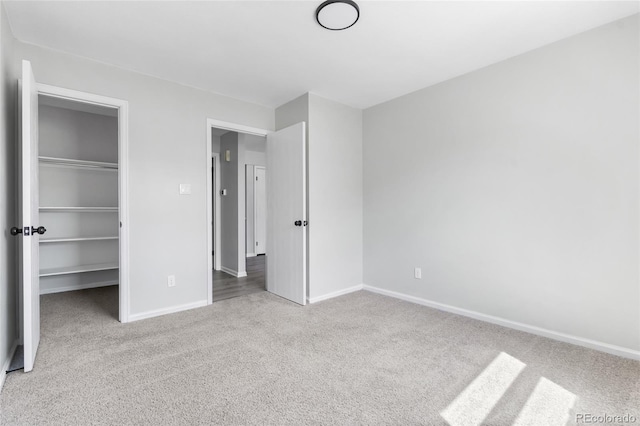1740 S Ammons St Unit C, Lakewood, CO 80232 - unfurnished bedroom featuring carpet floors, baseboards, a spacious closet, and a closet