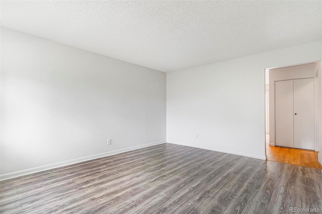 5711 W 92nd Ave Unit 47, Westminster, CO 80031 - empty room with wood finished floors, a textured ceiling, and baseboards