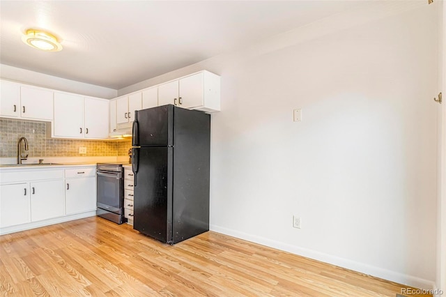 5711 W 92nd Ave Unit 47, Westminster, CO 80031 - kitchen with freestanding refrigerator, stainless steel range, a sink, light countertops, and light wood-type flooring