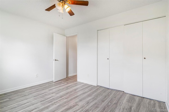 5711 W 92nd Ave Unit 47, Westminster, CO 80031 - unfurnished bedroom featuring light wood-type flooring, a closet, a ceiling fan, and baseboards