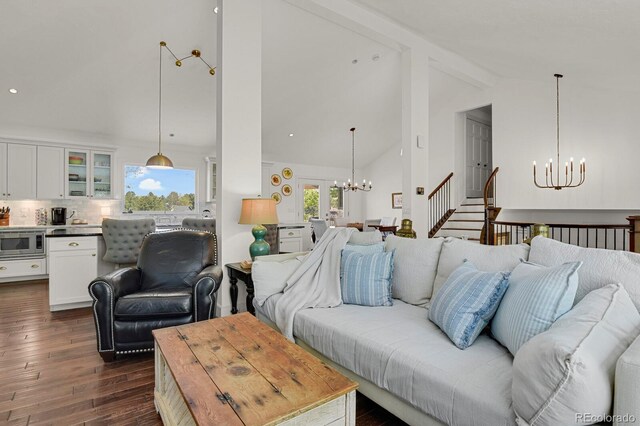 7605 E Windlawn Way, Parker, CO 80134 - living area featuring a chandelier, beamed ceiling, dark wood finished floors, and high vaulted ceiling